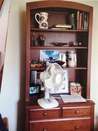 Modern storage unit with display space for collectibles and drawers 