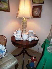 Another slender parlor table with snow white Franciscan dishes