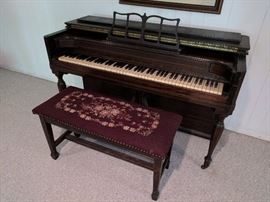 Spinet piano with embroidered bench