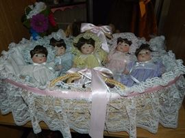 Dionne quintuplet porcelain dolls in bassinet 