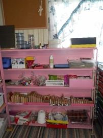 Another pink shelf full of stamps of all sizes plus lots of various crafting items