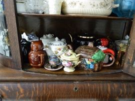 Curio is full of all Kinds of items - bottom shelf