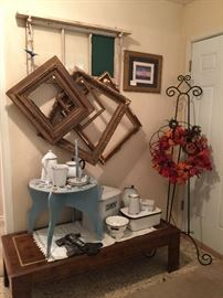 In the entrance you will also find, a wonderful old window with a chalk board insert, great vintage frames, a very nice collection of enamel ware, prints, easel, coffee table, a very cute painted clock table
