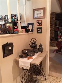 In the entrance you will find a old singer sewing machine base with a marble top, silver plate, an English paper holder, and more Scottie items