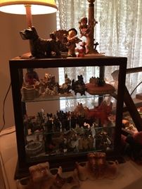 This show case has a wonderful collection of Vintage smaller Scottie and West Highland collectables, Goebel lamp, Scottie planters