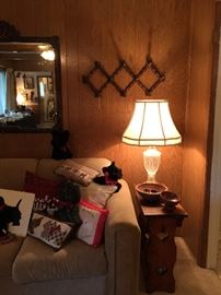 Country style side table with storage, wood elephants, lamp, a collection of wood and pottery bowls