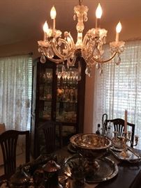 Dinning room with a closer look at the chandelier which has 6 arms