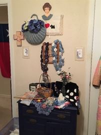 In the linen room you will find this antique painted wash stand, quilt items, and button flowers, collection of belts