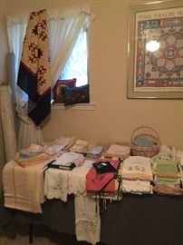 Lots of quilt tops and vintage quilts