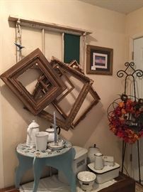 A close look at the vintage frames, enamel ware and clock table