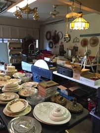 Looking into the garage, lots of glass, china, tools, light fixtures