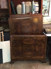 There are two of these flamed mahogany twin beds with rails, great detail, crocks, vintage flasks,