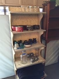 Vintage bakery display shelf, vintage tins, insulators, jars and bottles