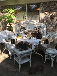 Old wicker head board, wicker chairs, side table and stool, collection of bird houses, metal art pieces