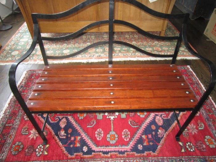 Heavy wrought iron and wood bench