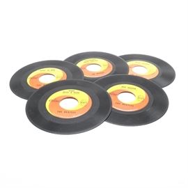 Collection of The Beatles 45s from Capitol Records: A collection of The Beatles 45s on orange/yellow label Capitol Records. This collection features singles by The Beatles including “Hello Goodbye” #2056, “Eight Days a Week” #5371, “Day Tripper” #5555, “Ticket to Ride” #5407, and “Strawberry Fields Forever” #5810. Each record features the yellow/orange swirl Capitol records label.