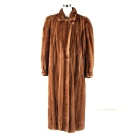 Jindo Full Length Women's Mink Fur Coat: A Jindo full length women’s mink fur coat. This coat features a brown mink fur exterior and Bemberg lining. It is monogrammed “JEF” in the inner right and marked “Jindo” on the inside tag.