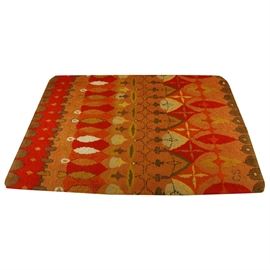 Vintage Cynthia Sargent Hooked "Bartok" Shag Rug: A vintage Bartok Modernist hooked rug by Cynthia Sargent. Sargent, an artist trained in art and design, moved from New York City to Mexico City in 1951, founding with her husband a weekly crafts bazaar and market called Bazar Sabado in San Angel, and also founding a manufactory where they made a variety of textiles and hooked rugs. This bright, mid-century rug features an abstract pattern of stars, leaf forms, and arches in saturated reds, oranges, ochre, moss green and taupe. It has bound seams to the underside. The initials “CS” are inscribed in the lower left corner; otherwise, the rug is unlabeled.