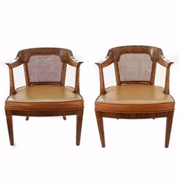Pair of Vintage Henredon Armchairs: A pair of vintage armchairs by Henredon. Each chair features a cane back, curved crest rail, curved arm rests, padded vinyl upholstered seat, and four tapered legs. The chairs are marked “Henredon Fine Furniture” the bottom. Items match 17LAX169-002 and 17LAX169-003.