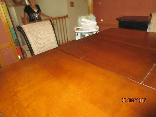 Dining table with leaf popped up