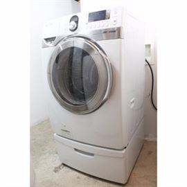 Samsung Washing Machine: A Samsung washing machine in white. This front loading washer is model number DC68-02722A and sits upon a singular drawer pedestal.
This item coordinates with 17COL101-098 in this sale.