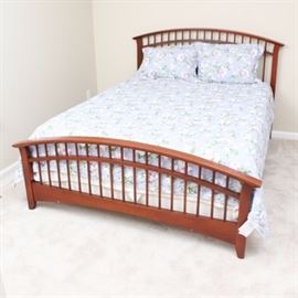 Hardwood Queen Bed: A queen size hardwood bed. Stained in a cherry finish, this Shaker style bed features curved head and foot boards with open spindle design.
Coordinating dresser 17COL101-001 and nightstands 17COL101-002 are also found in this sale.