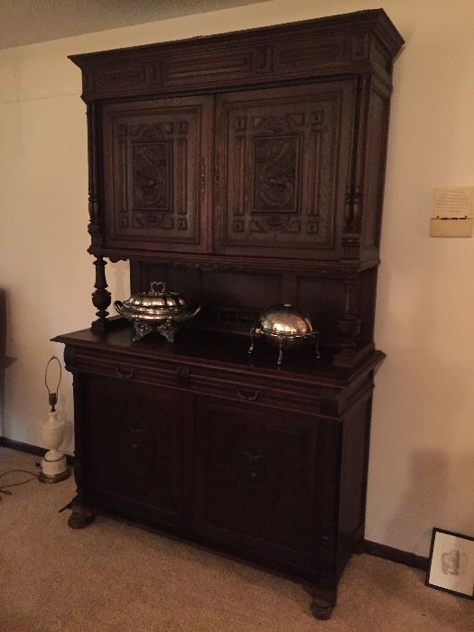 Magnificent English dark oak Cabinet, 19th century, fully carved and in excellent condition.  A very imposing piece of furniture.