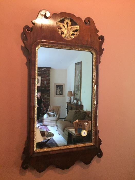 A museum quality English Chippendale Mirror dating from the mid-eighteenth century.  Original gilding and original mirror glass.  Moderate size  perfect to fit over a chest of drawers or hall table.  This is an exceptionally rare piece.