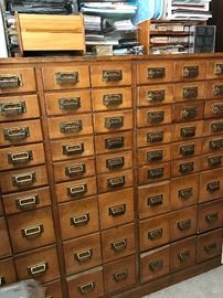 AWESOME Vintage Library card holder. Very heavy!  Made of wood. The drawers sides are made of metal and it looks like an old sign. 