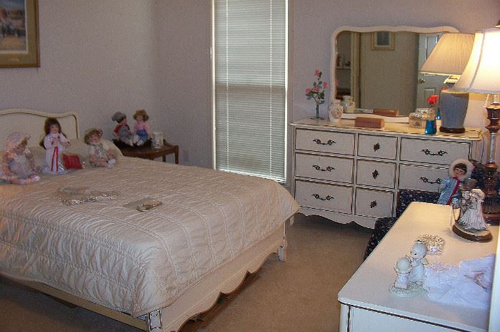 French provincial bedroom consisting of double bed, dresser with mirror, nightstand and desk