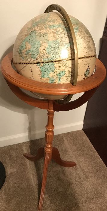 World Globe on wooden stand.