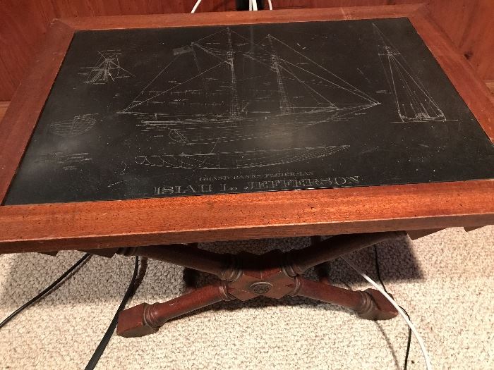 wooden table with ship motif
