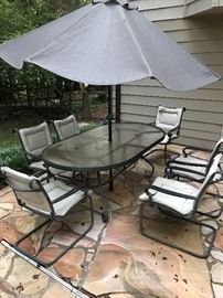 Patio table with 6 chairs and umbrella