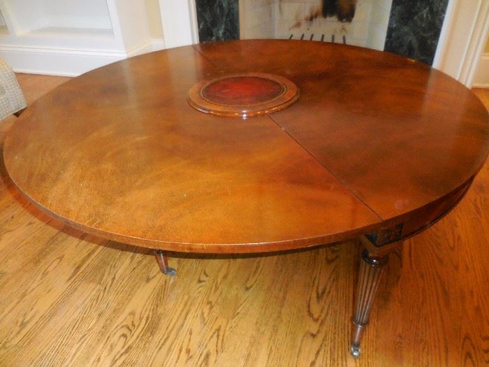 Very interesting Mahogany Open, Fold Cocktail Table. Full Circle Open, Mahogany with Middle Centerpiece Leather. 