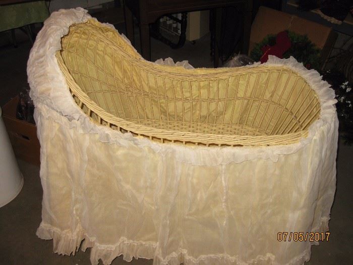 Antique cradle with skirt.