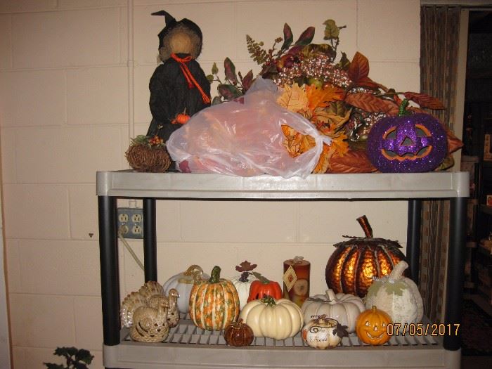 Two shelving units of Halloween decorations.