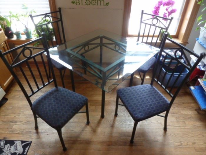 Wrought Iron and Glass Table with Matching Wrought Iron Upholstered Chairs
