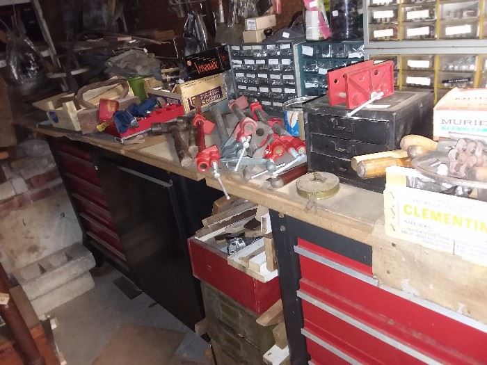 packed basement with hand tools, odds and ends, hardware, metal tool boxes and more