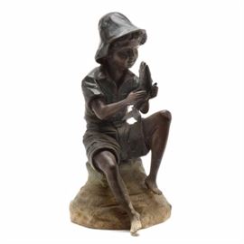 Frontgate Fountain of a Boy with a Fish: A Frontgate fountain of a boy with a fish. This is a statue of a boy sitting on a rock holding a fish between his hands. The fish has a hole in its mouth for water to spout out from. There is a pipe to the bottom for connecting a water source. Fountain is untested.