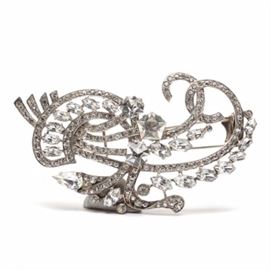 Sterling Mid-Century Eisenberg Ice Fur Clip: A mid-century Eisenberg sterling silver fur clip. This impressive piece features an array of clear, colorless rhinestones of various cuts and shapes. It is marked “Eisenberg ORIGINAL” in the script-like style typical of the 1940s, with the word “STERLING” to pin closure. There is also an incised number 3 located to reverse of piece. The total weight, inclusive of all materials, is 1.800 ozt.