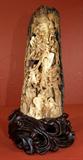 Lot 85
E6-1 WOOLLY MAMMOTH CARVED TUSK
Intricately carved scene of monkeys in a willow tree. Includes wood carved base. Measures 9 3/4" tall. Estimate $4,000 - $7,000