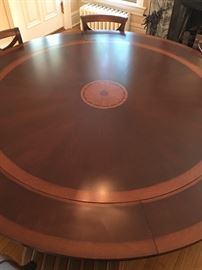 AVAILABLE FOR PRESALE: Stunning round custom pedestal dining table with crescent leaves. 66" diameter extends to 84". 