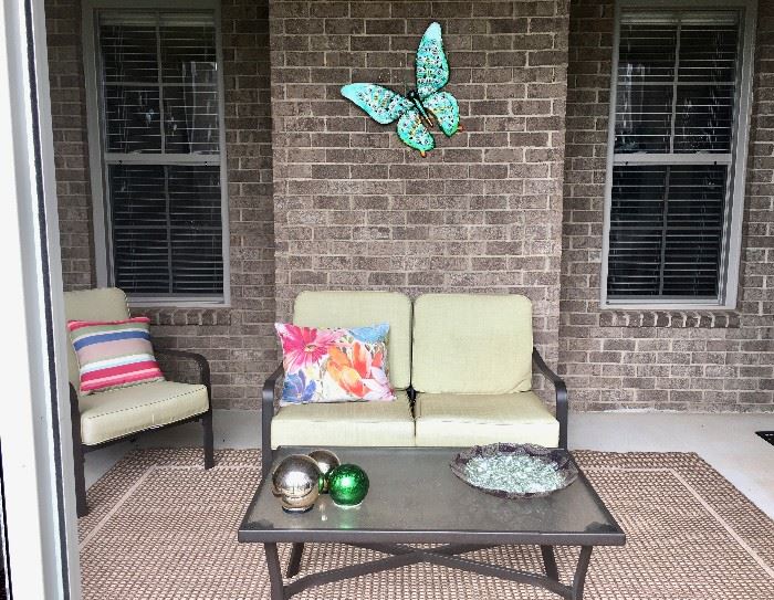 Patio set so like new, no stains on cushions, plus outdoor rug, glass/metal table to match