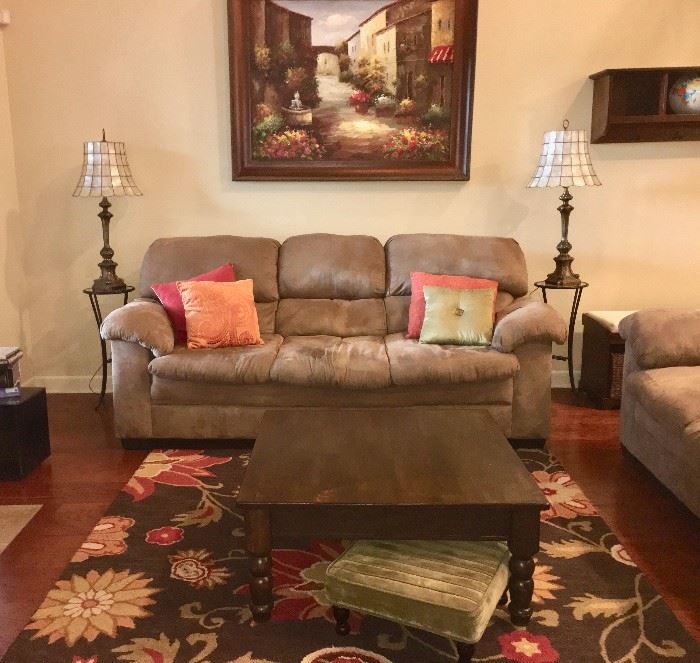Front view sofa, coffee table, plus vintage cast-metal lamps with capiz-shell shades; scenic art
