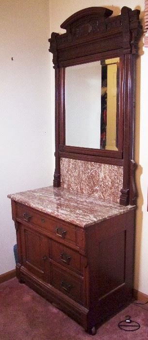 C/1880 Beautiful Cherry Eastlake 3 pc. Bedroom Suite w/High back full size bed, marble top dresser w/beveled mirror and matching marble top washstand w/beveled mirror.  Bed 84" h., dresser 85" h. and washstand 78" h. (All in Orig. Good Finish)