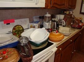 Lots of Kitchenware! Pots & Pans, Bakeware, Cookware, Toaster, Coffee Maker, Elec. Can Opener, Pampered Chef Items, Pie Plates, Casserole Dishes, Cookie Cutters.....and more!!