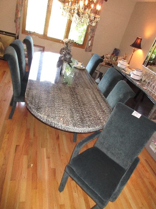 VERY unusual black dining room table, 2 large leaves, with 8 chairs