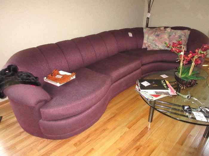 WHOAA, just look at this bad boy, a lavender/purple swirling sectional sofa, VERY COOL