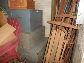 IN Barn many wooden trunks, sleds...