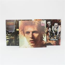Vintage David Bowie LPs: A grouping of David Bowie LPs, including Ziggy Stardust, Space Oddity, and Diamond Dogs. Ziggy Stardust is labeled “LSP-4702” and copyright 1972. Space Oddity is labeled “LSP-4813” and is copyright 1972. Diamond Dogs is labeled “CPL1-0576” and is copyright 1974. All three of these LPs were released on RCA Records of NY, NY.